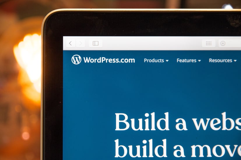 Laptop screen with WordPress.com in the left corner